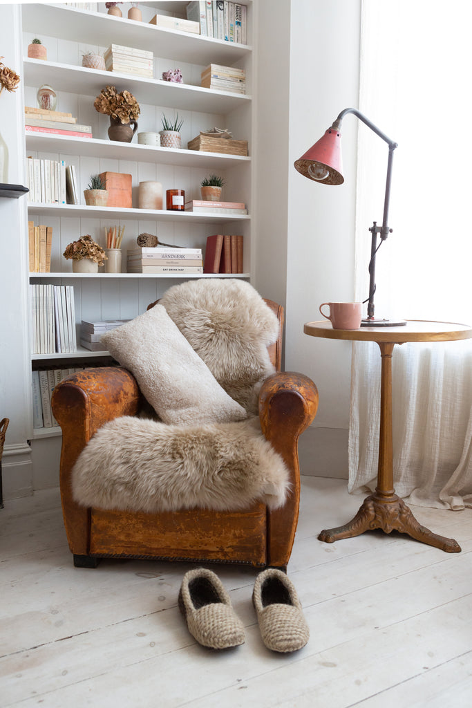 Sheepskin cushion styled on chair