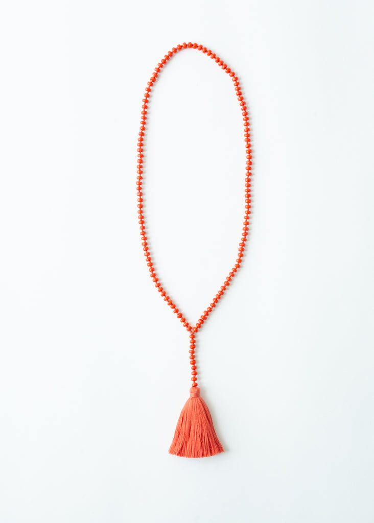 Long beaded red tassel necklace