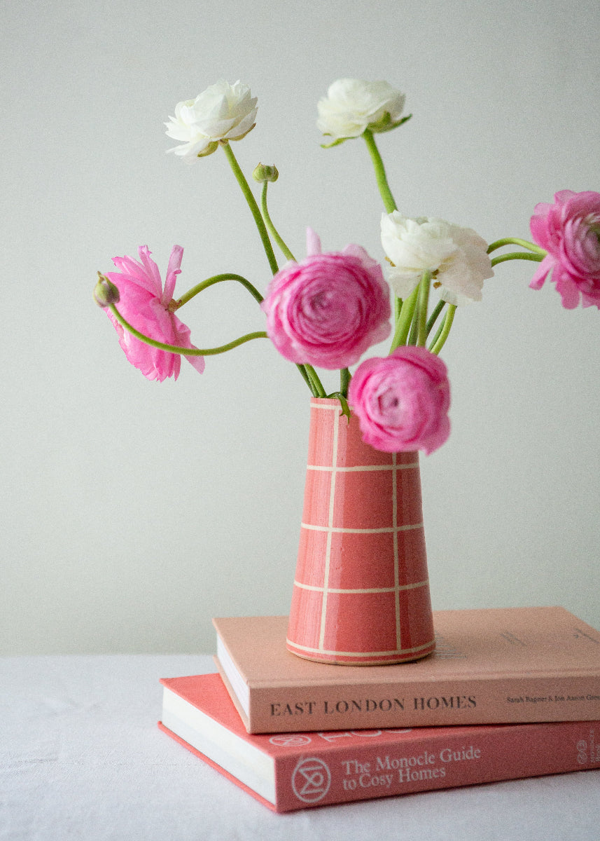 bright pink handmade vase with flowers
