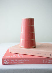 bright pink vase with a grid pattern