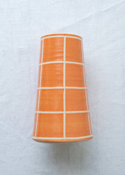 orange handmade vase with grid pattern 