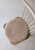 Natural sheepskin seat pad in soft oatmeal, with inner foam cushion and non-slip microfibre base
