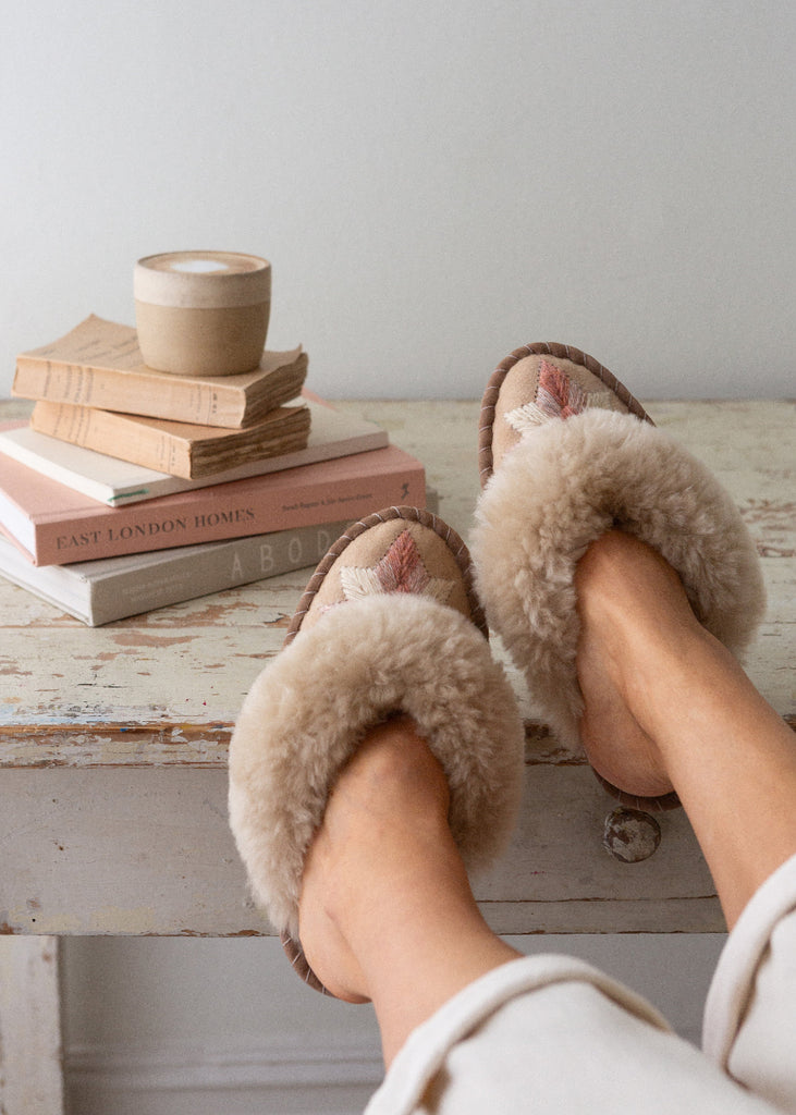 sheepskin slippers with a coffee cup