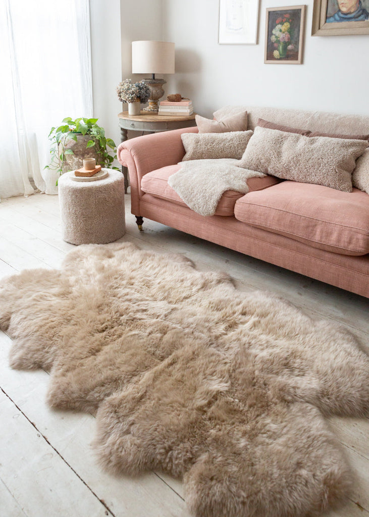 quatro sheepskin rug by a sofa