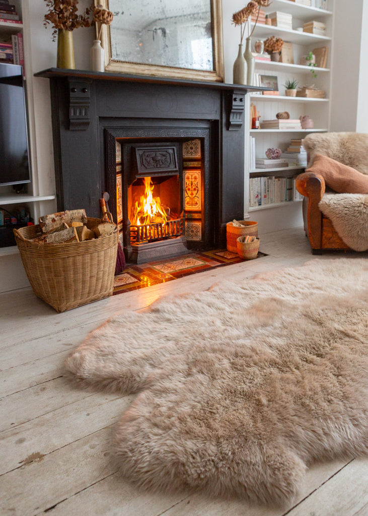 extra large sheepskin rug by a fire 