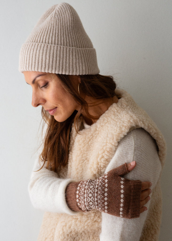 brown and white wrist warmers