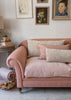 Large sheepskin cushion styled on sofa
