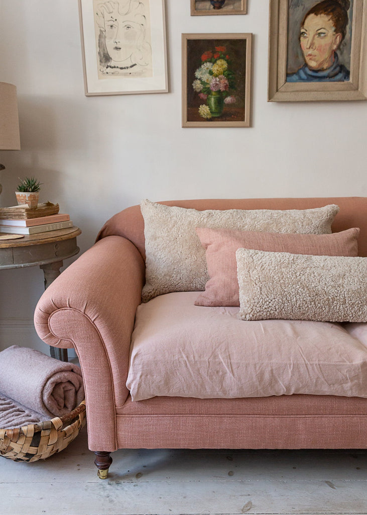 Large sheepskin cushion styled on sofa