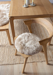 Luxury Nappa sheepskin seat pad in natural tone, with inner foam cushion and non-slip microfibre base