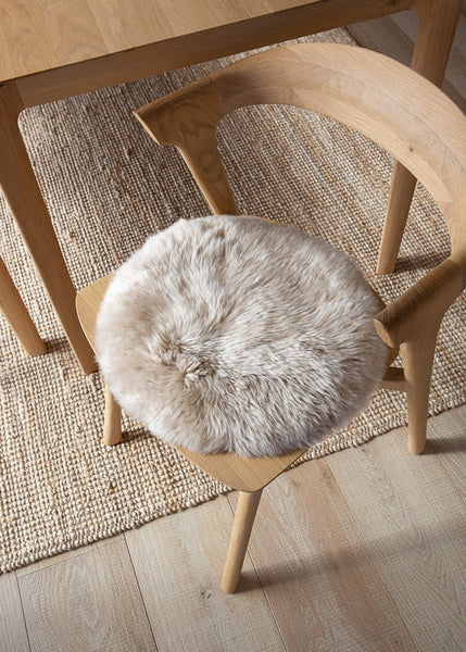 Luxury Nappa sheepskin seat pad in natural tone, with inner foam cushion and non-slip microfibre base
