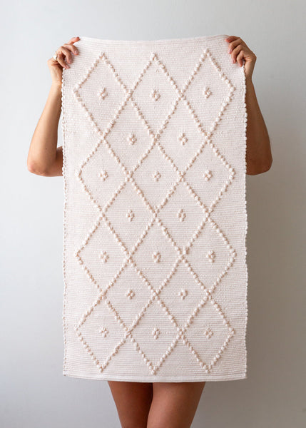 cream bath mat
